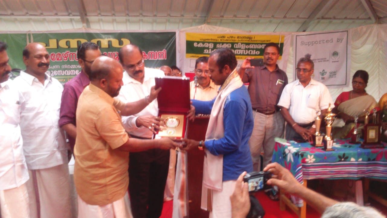 Anil receives award in recognition of protection of rare jack fruit varieties from Kerala Agriculture Minister VS Sunil Kumar