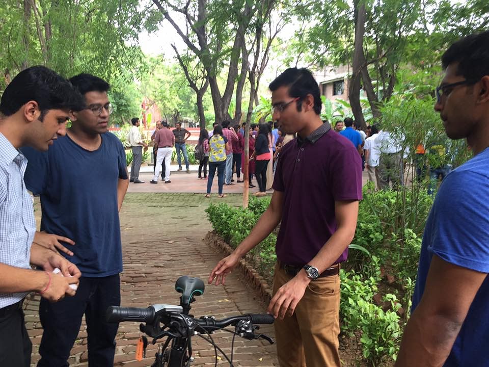 Lightspeed demonstrating their e-bike prototype and collecting feedback from university students in Ahmedabad.
