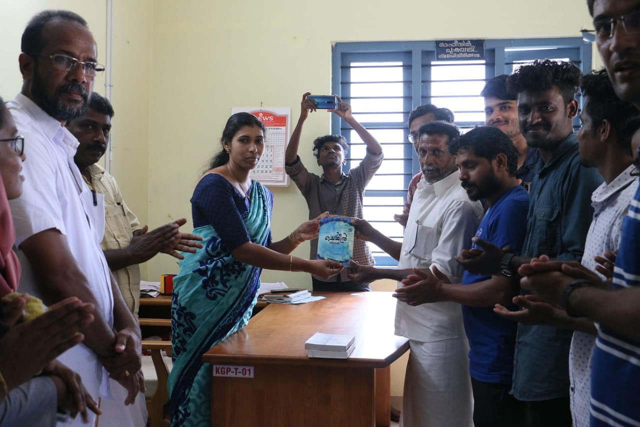 Students hand over books for tribal community