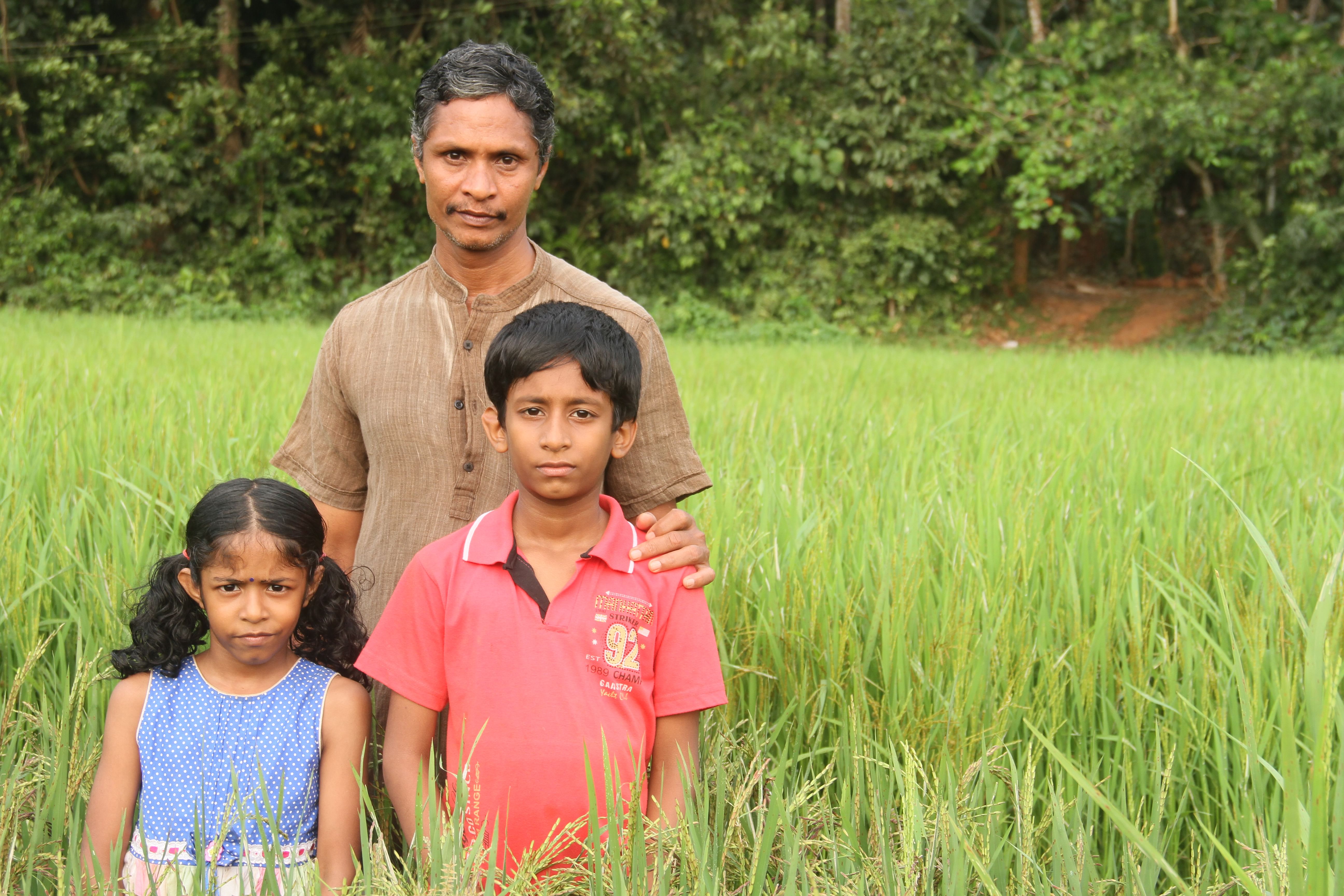 Jayakrishnan, conservator of 118 rare rice varieties, with his children